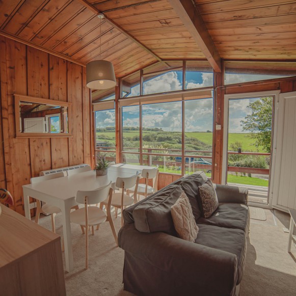 Cosy Timber Hill lodge livingroom views 